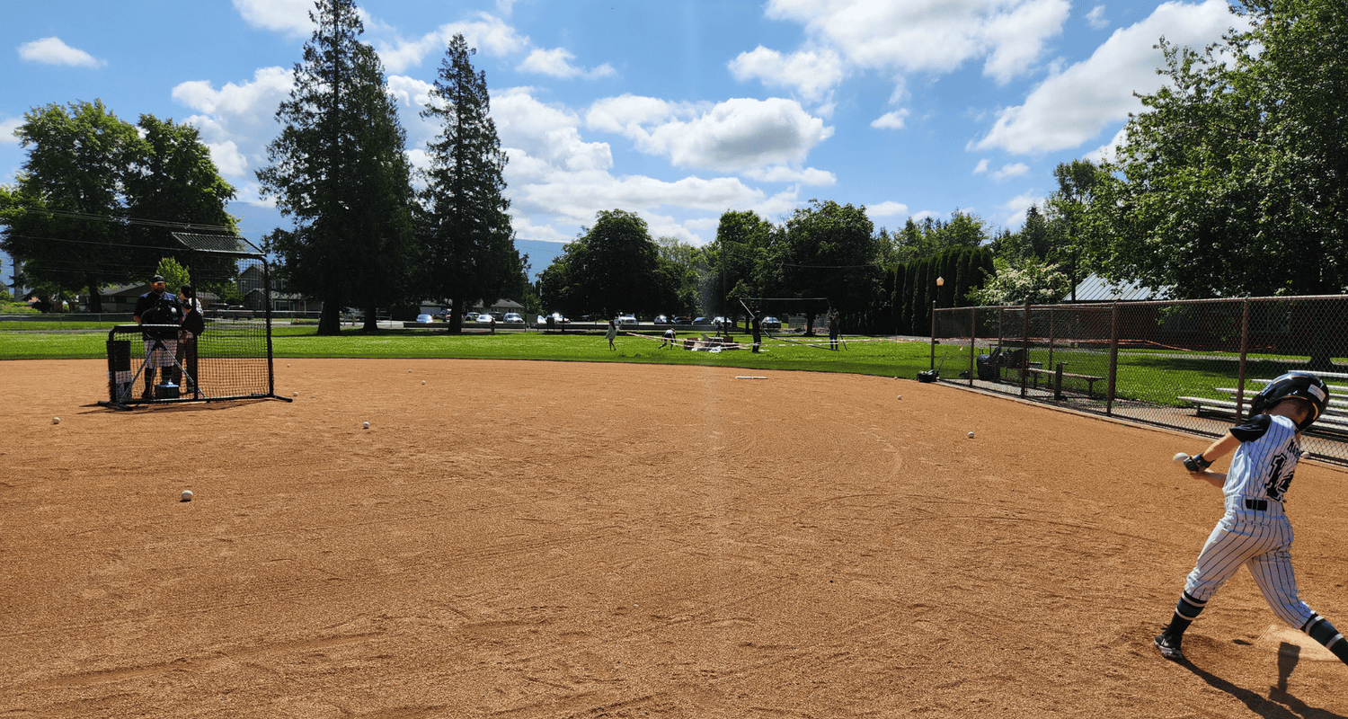 The Benefits of Hitting on a Pitching Machine vs. a Live Pitcher