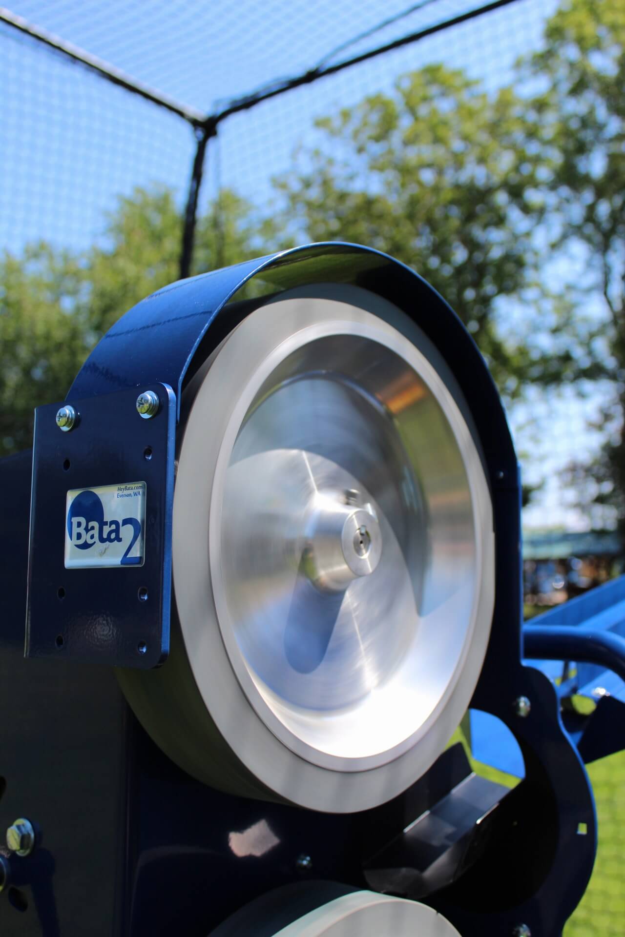 Upper Bata 2 pitching machine wheel while in a batting cage