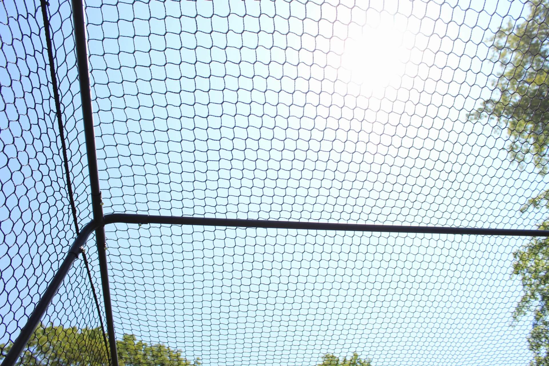 Top of trapezoid batting cage while inside