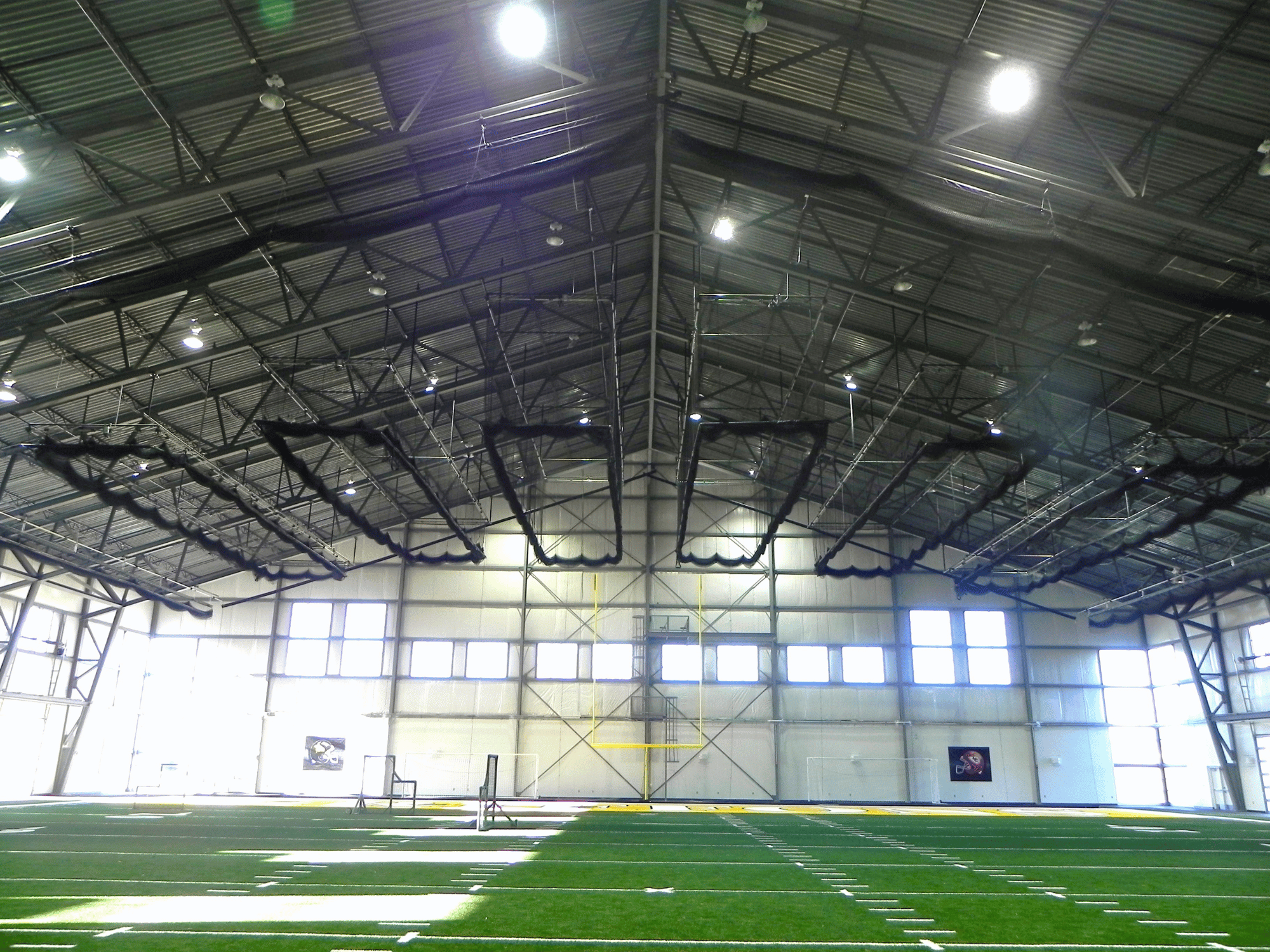 Many Batting Cage Nets suspended to the top of the facility