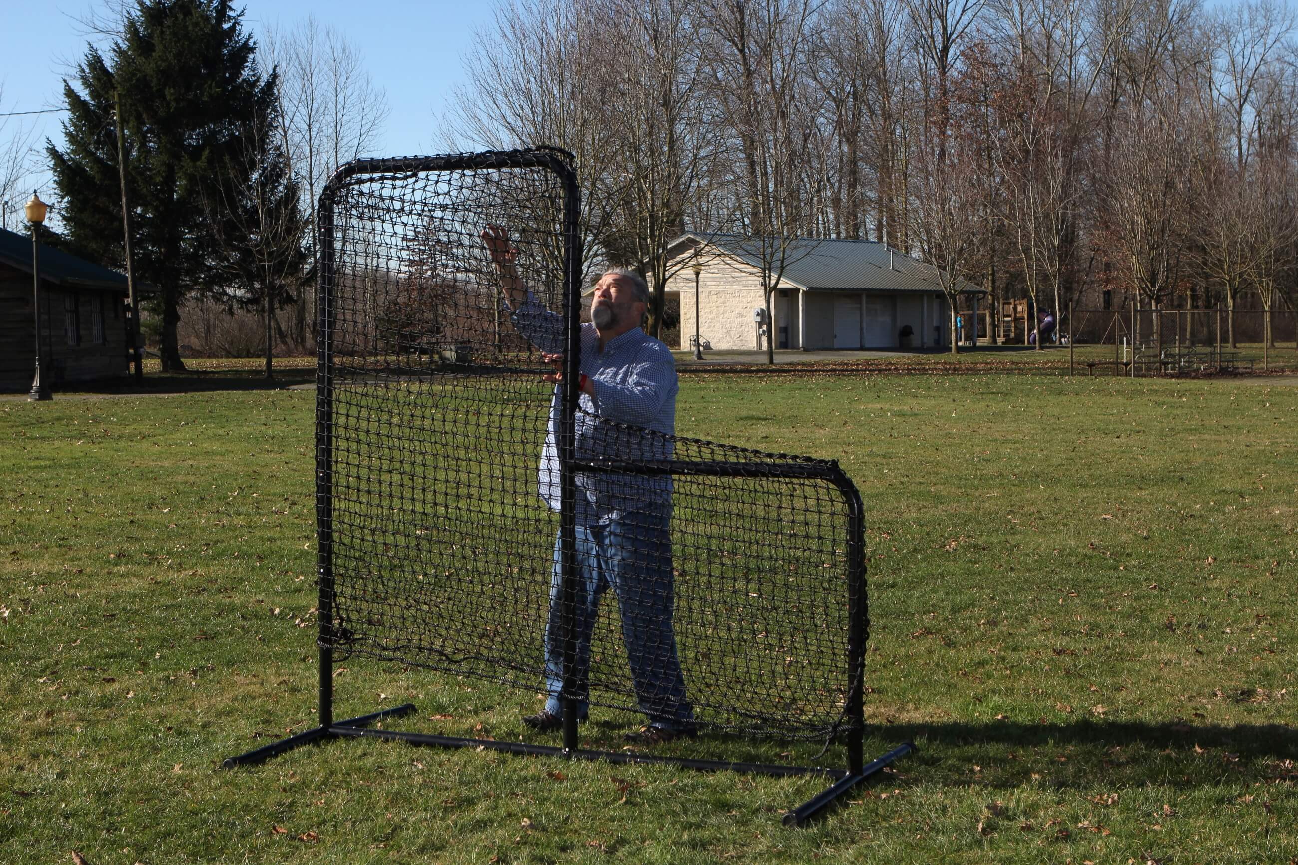 Man putting on standard L-Screen net