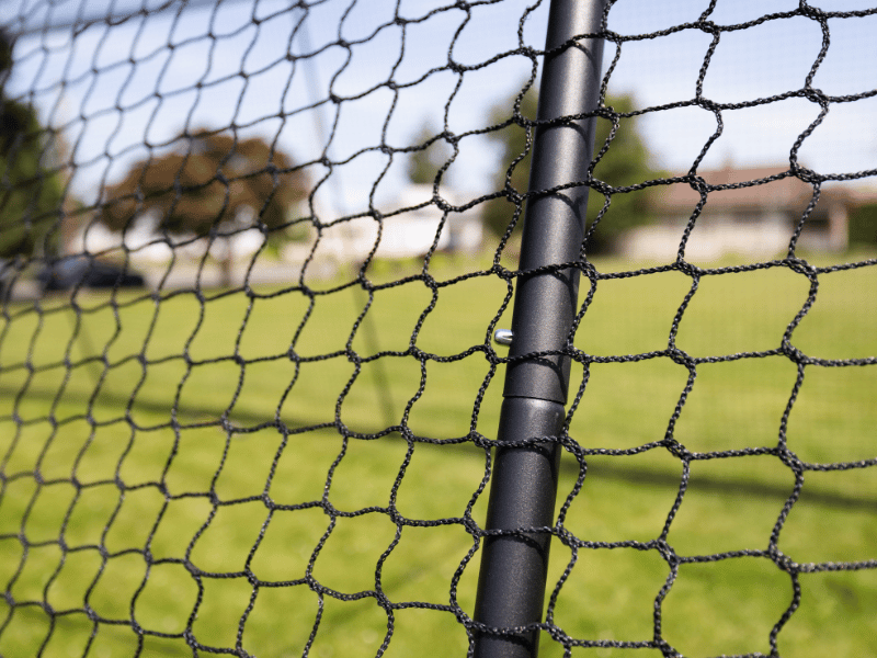 Trapezoid netting over the top of the batting cage pole
