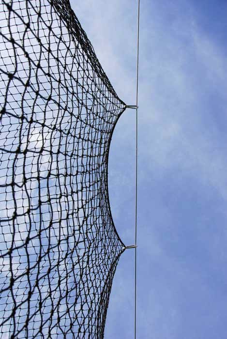 Batting cage netting clipped to the cable