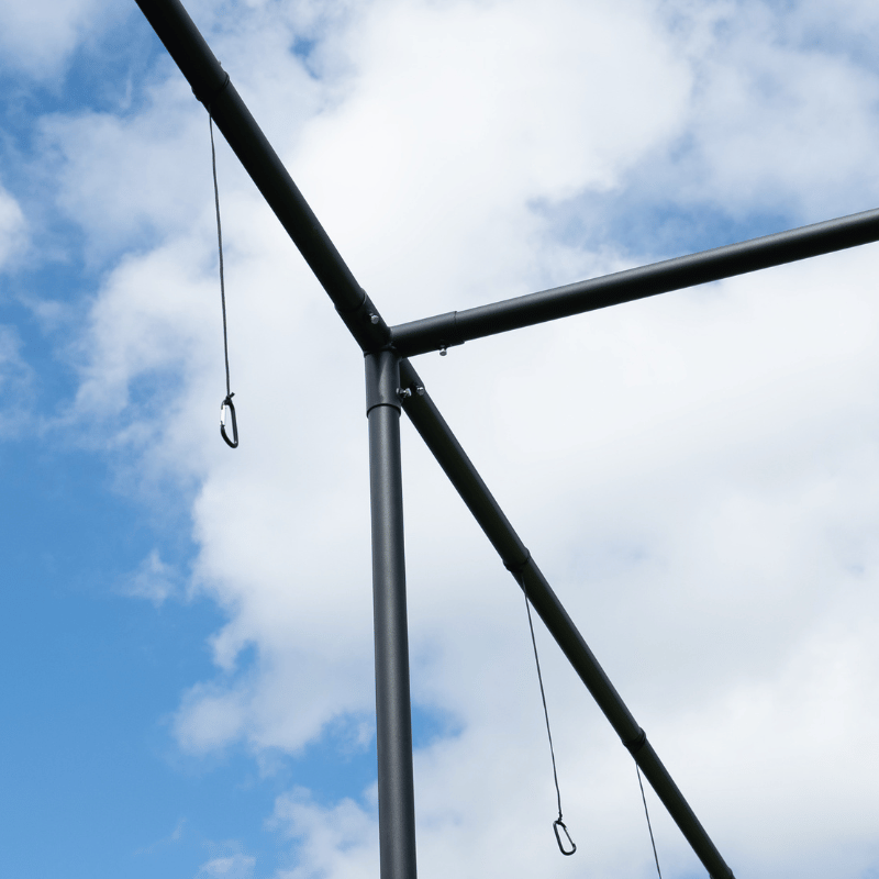 The Thumper batting cage frame with clips hanging ready for netting