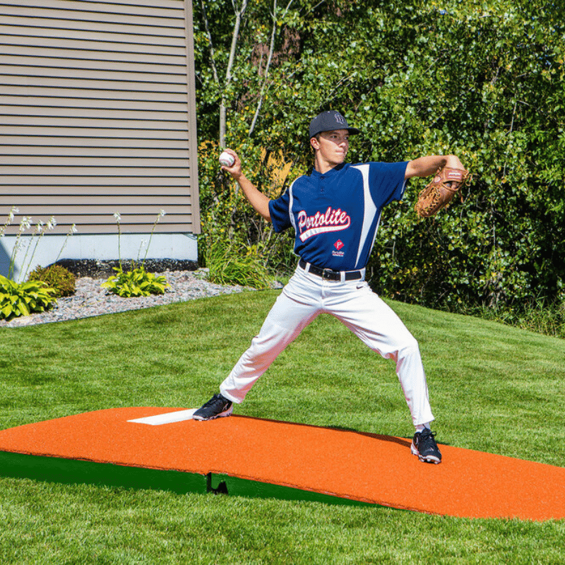 Man pitching off of the 10in Oversize Practice Mound with Turf Clay