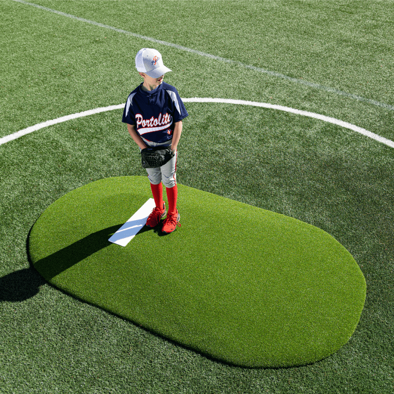 Boy pitching off of the Portolite 6in Full Length Game Mound