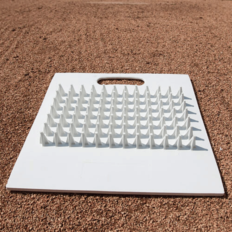 Cleat & Spike Cleaner on baseball infield
