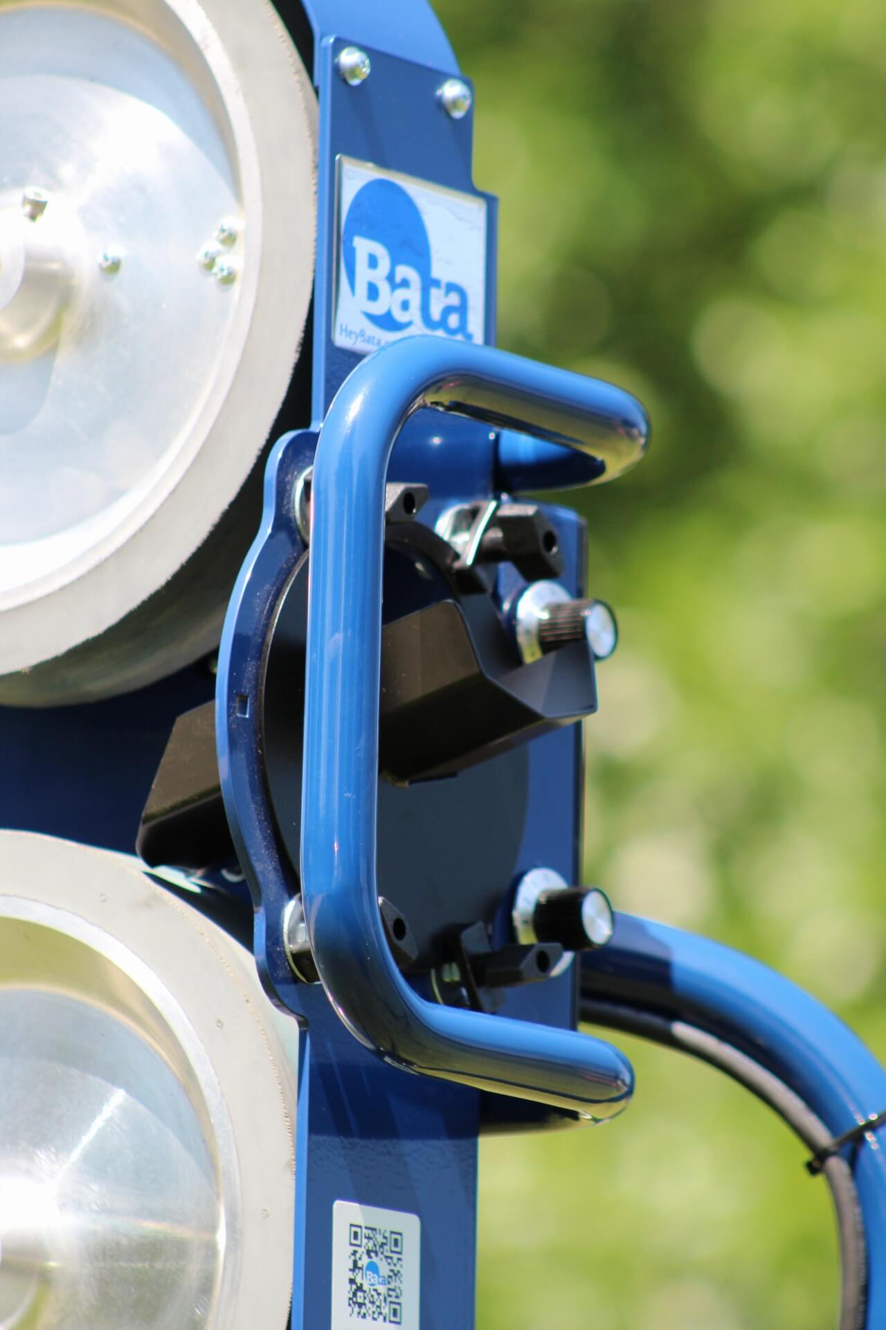 Front handle and feed chute on the bata 2 pitching machine