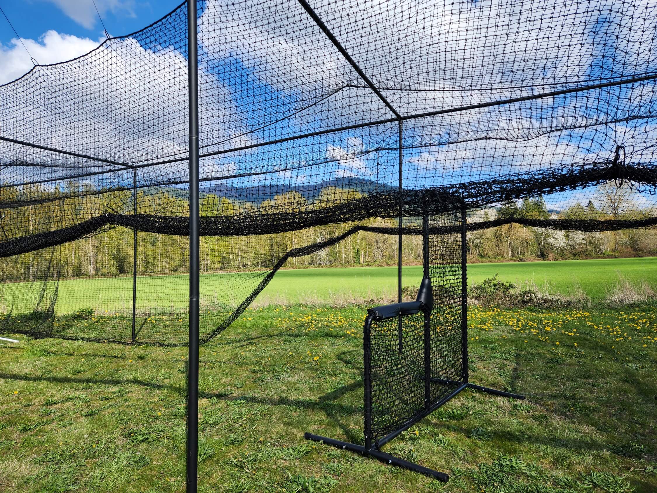 Thumper batting cage net rolled up when not in use