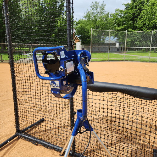 The Bata b1 curveball pitching machine behind the Armadillo L-screen