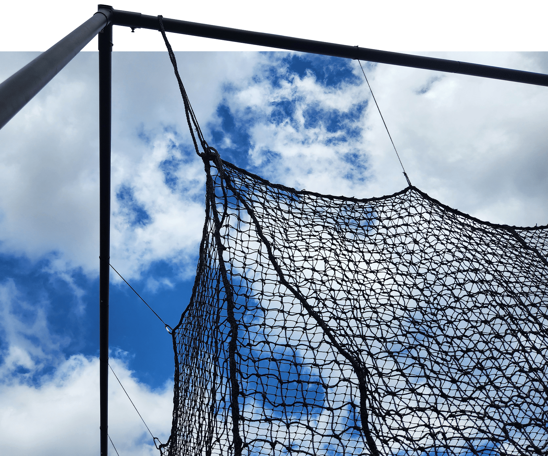 Close up view of batting cage net entry flap door