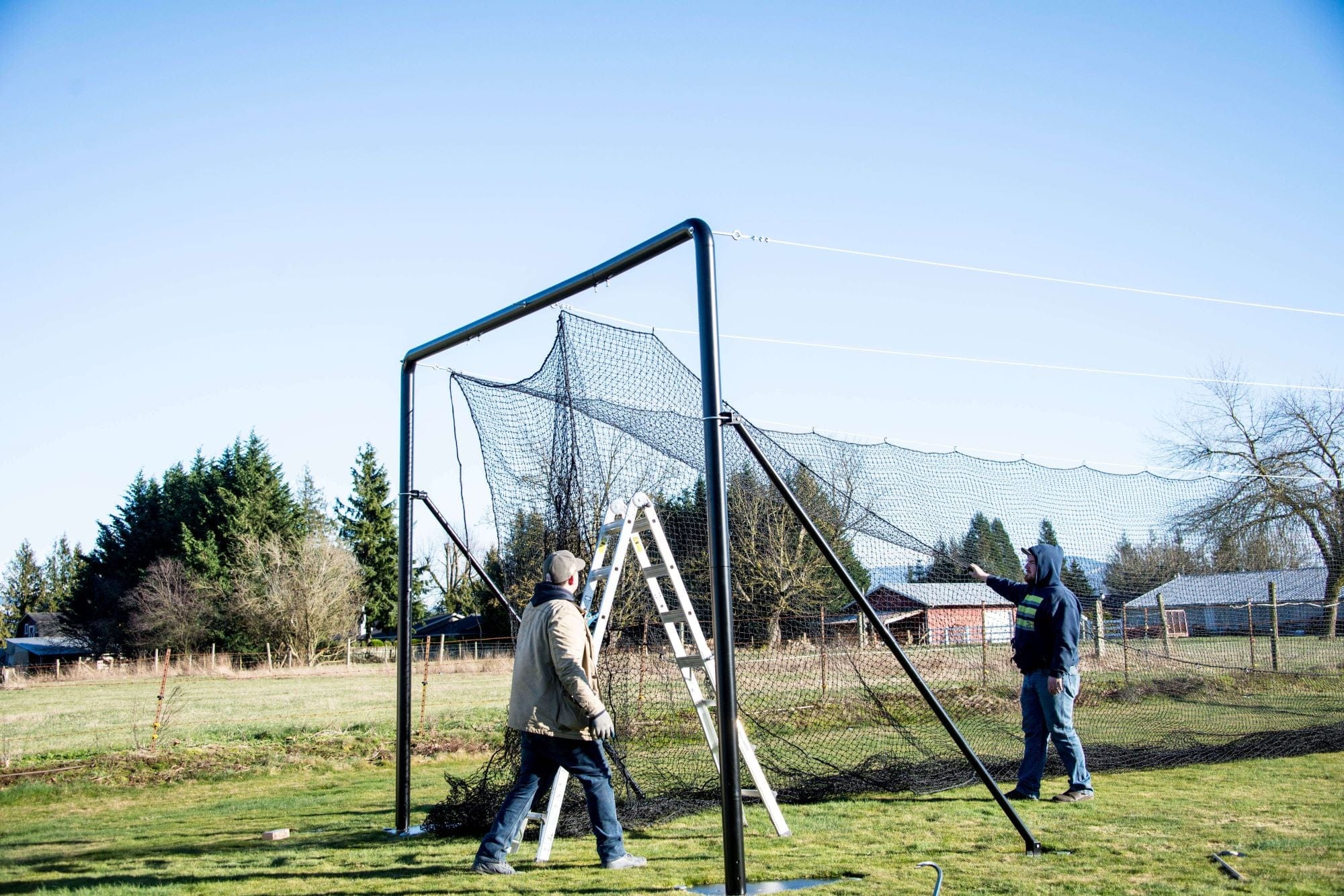 Hanging the batting cage net on the Iron horse batting cage