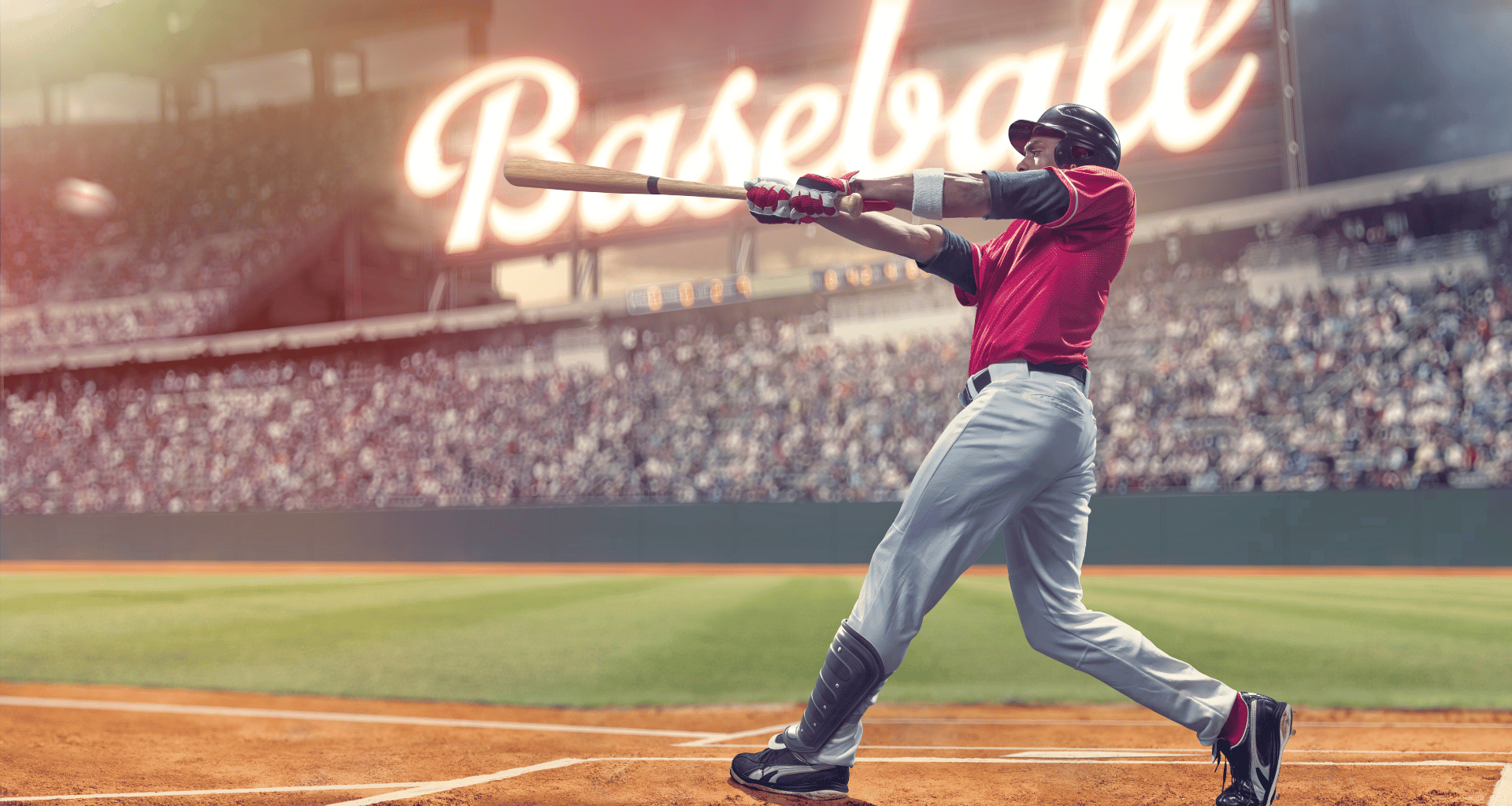 Man hitting a baseball on field with full stadium