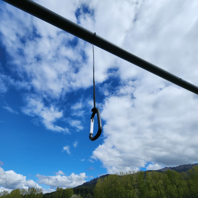 Cage Hangers and Carabiner Clips hanging from frame ready for netting