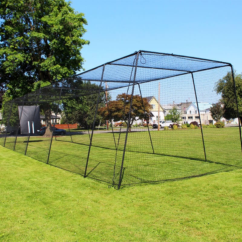 Freestanding Trapezoid Batting Cage in a park with green grass and trees