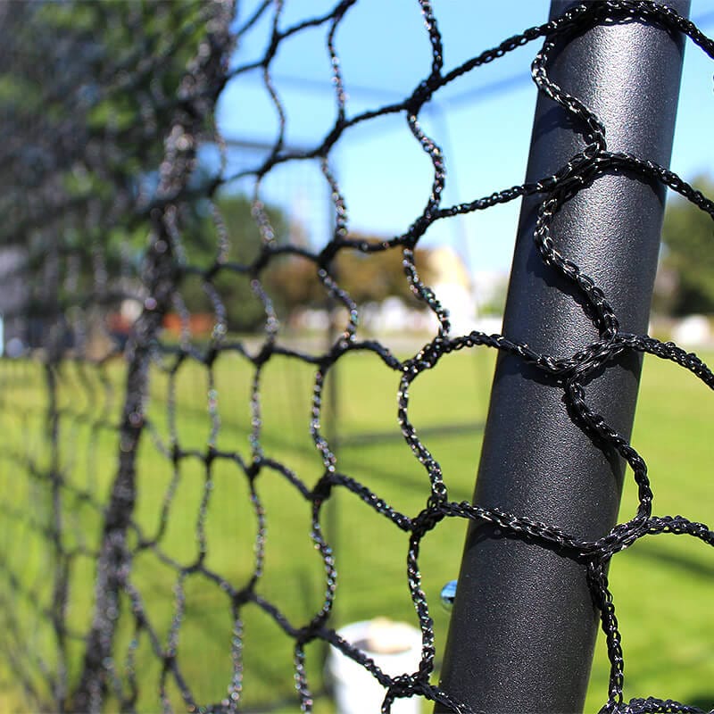Close up of the #32 HDPE Trapezoid Batting Net on batting cage poles