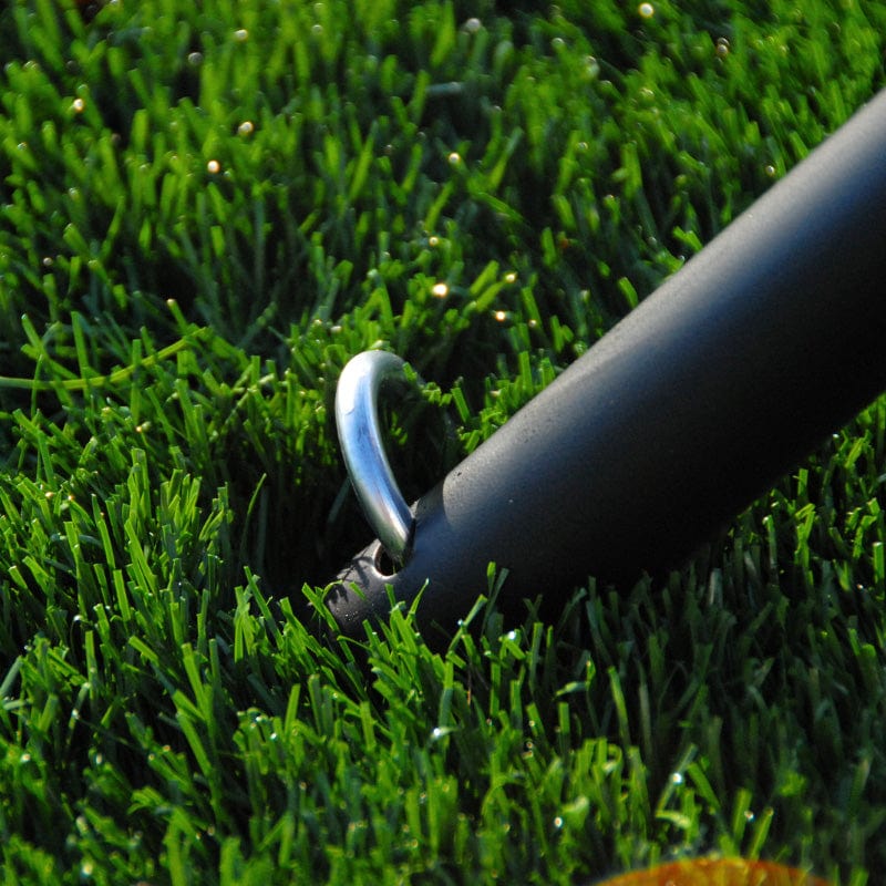 Trapezoid Batting Cage stakes put into the ground and poles
