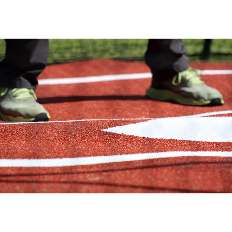 Man standing on Clay Deluxe Batter's Box Mat