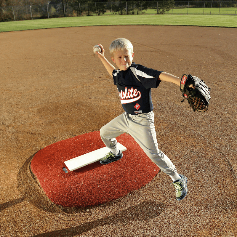Boy pitching on Portolite 4in Stride Off Game Mound Red